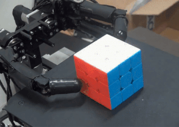 анимация - робот подобно человеку собирает кубик Рубика